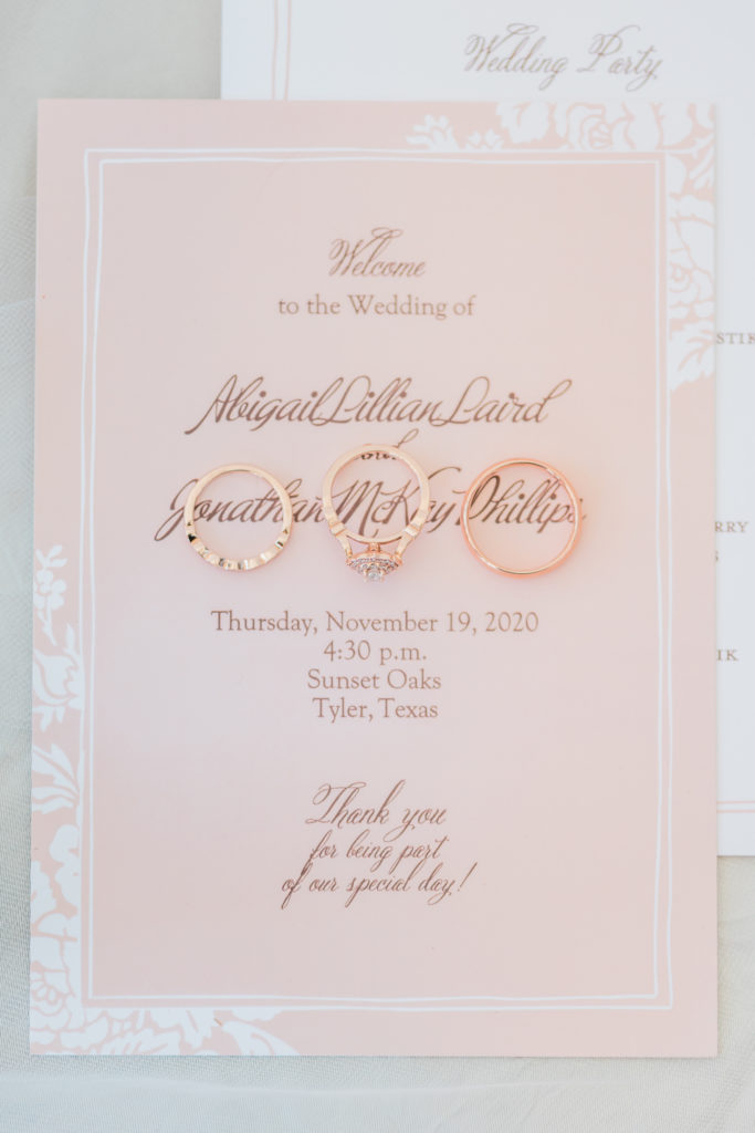Blush Rose Gold Wedding Details Rings Ceremony Program Invitation Jewelry Greenery Florals Baby’s Breath | Sunset Oaks in Tyler TX by DFW Dallas Fort Worth wedding photographer Karina Danielle Photography