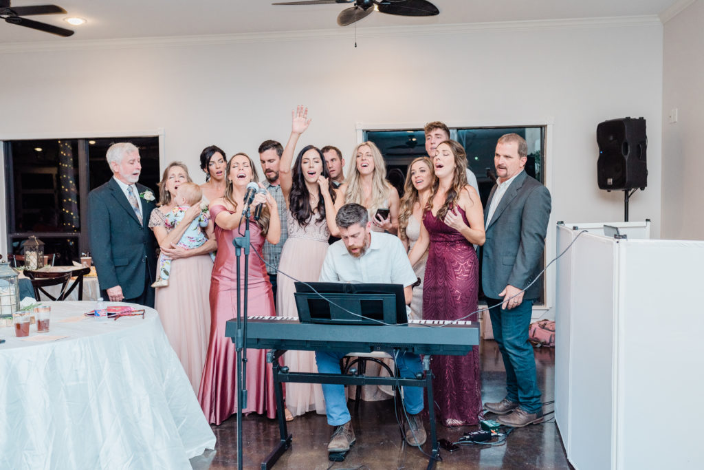 Wedding Reception Family Singing Performing Fall Blush Rose Gold Pink Wine Wedding | Sunset Oaks in Tyler TX by DFW Dallas Fort Worth wedding photographer Karina Danielle Photography