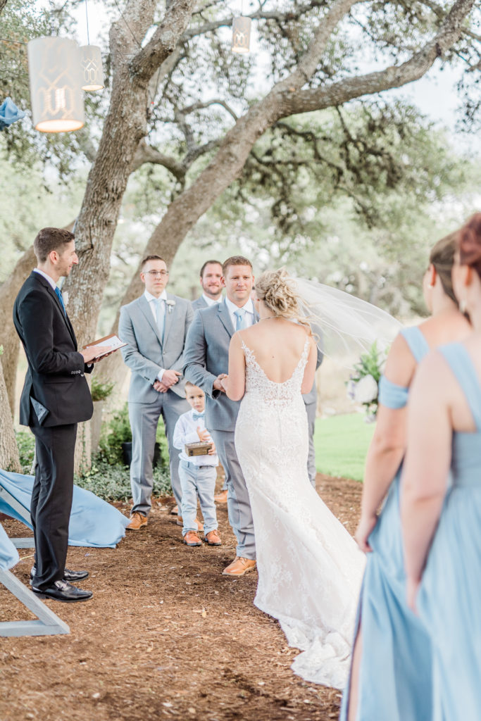 Wedding Ceremony Dusty Blue Arch | Stonehouse Villa in Driftwood TX by DFW Dallas Fort Worth wedding photographer Karina Danielle Photography