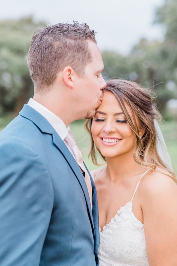 Bride and Groom Portrait Lace Dress Navy Suit | Stonehouse Villa in Driftwood TX by DFW Dallas Fort Worth wedding photographer Karina Danielle Photography
