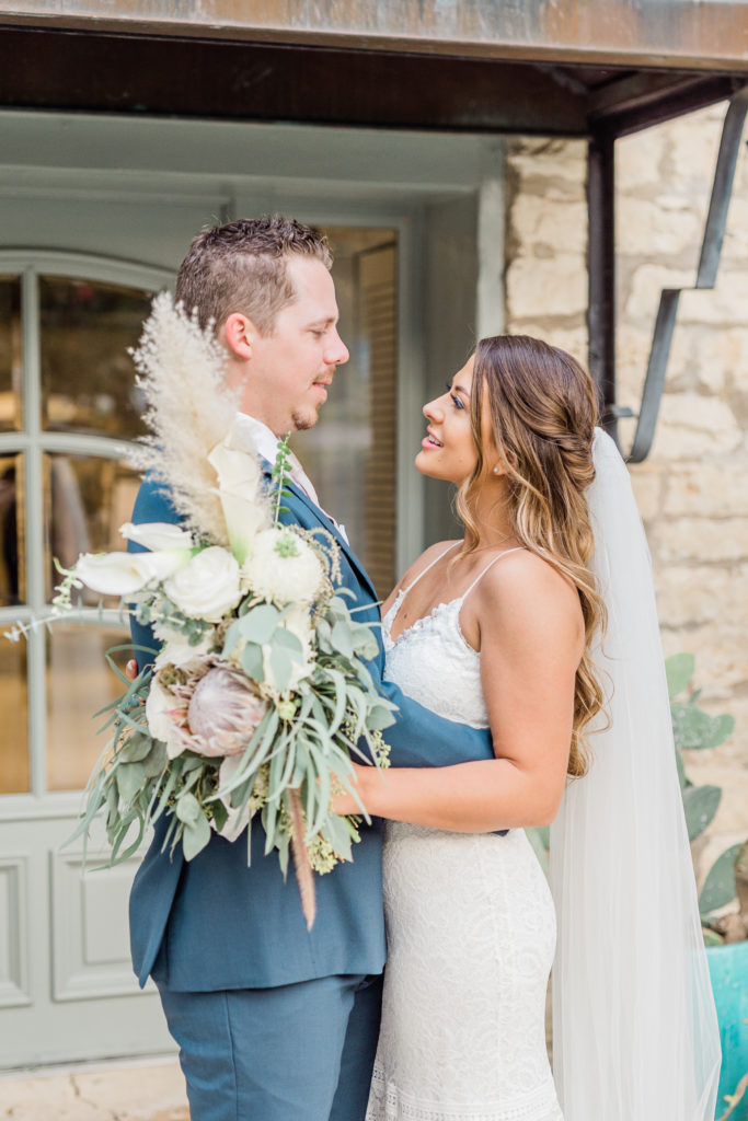 Bride and Groom Portrait Lace Dress Navy Suit Bouquet | Stonehouse Villa in Driftwood TX by DFW Dallas Fort Worth wedding photographer Karina Danielle Photography