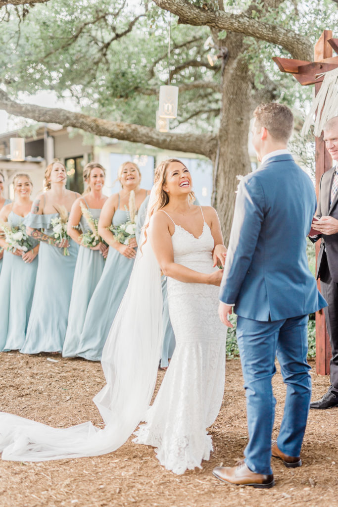 Bride and Groom Ceremony Lace Dress Navy Suit | Stonehouse Villa in Driftwood TX by DFW Dallas Fort Worth wedding photographer Karina Danielle Photography