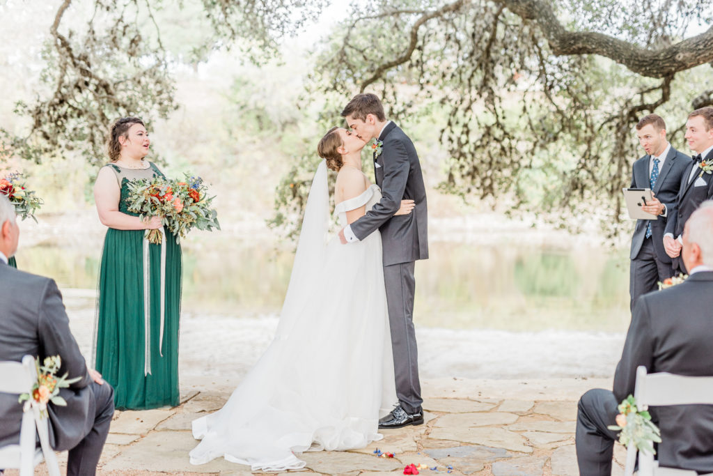 Bride and Groom Ceremony First Kiss | Tapatio Springs Operator Drewski Wedding in Boerne TX by DFW Dallas Fort Worth wedding photographer Karina Danielle Photography