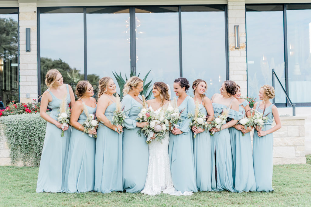 Bride and Bridesmaids Wedding Party Dusty Blue Dresses Pampas Grass Bouquet Boho | Stonehouse Villa in Driftwood TX by DFW Dallas Fort Worth wedding photographer Karina Danielle Photography