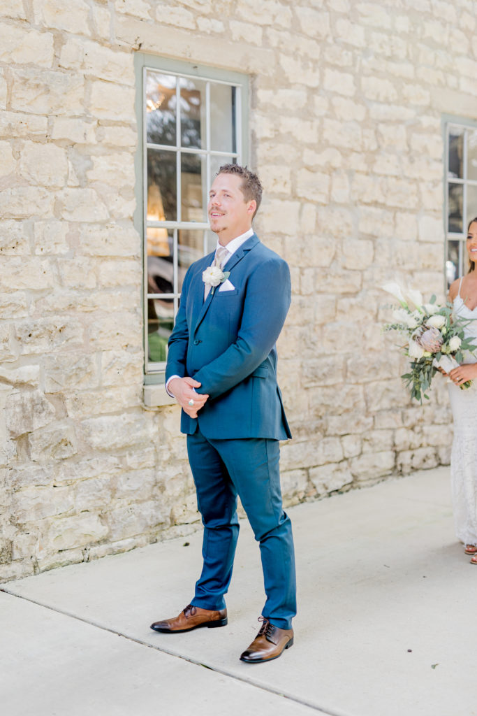 Bride and Groom First Look Lace Dress Navy Suit Pampas Grass Bouquet Boho | Stonehouse Villa in Driftwood TX by DFW Dallas Fort Worth wedding photographer Karina Danielle Photography