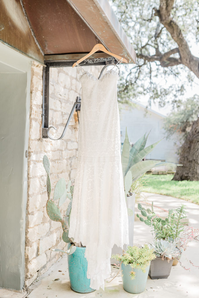 Wedding Dress Gown Hanging Hanger Venue Villa | Stonehouse Villa in Driftwood TX by DFW Dallas Fort Worth wedding photographer Karina Danielle Photography