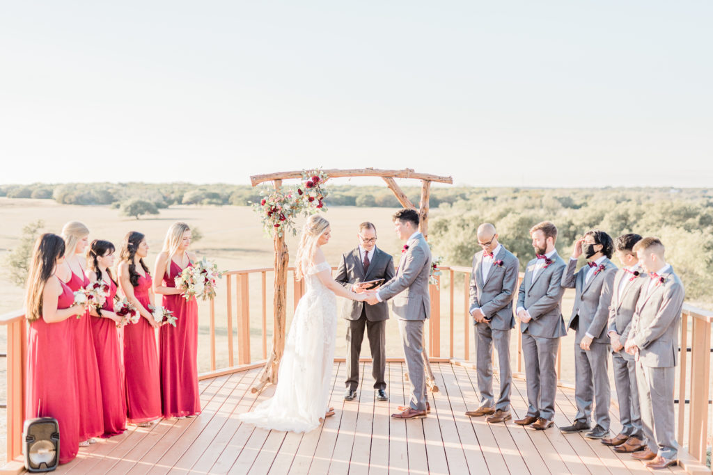 Bride and Groom Ceremony Strapless Dress Grey Suit Velvet Tie Blush and Wine Bouquet Eucalyptus | Wagon Springs Ranch in Burnet TX by DFW Dallas Fort Worth wedding photographer Karina Danielle Photography
