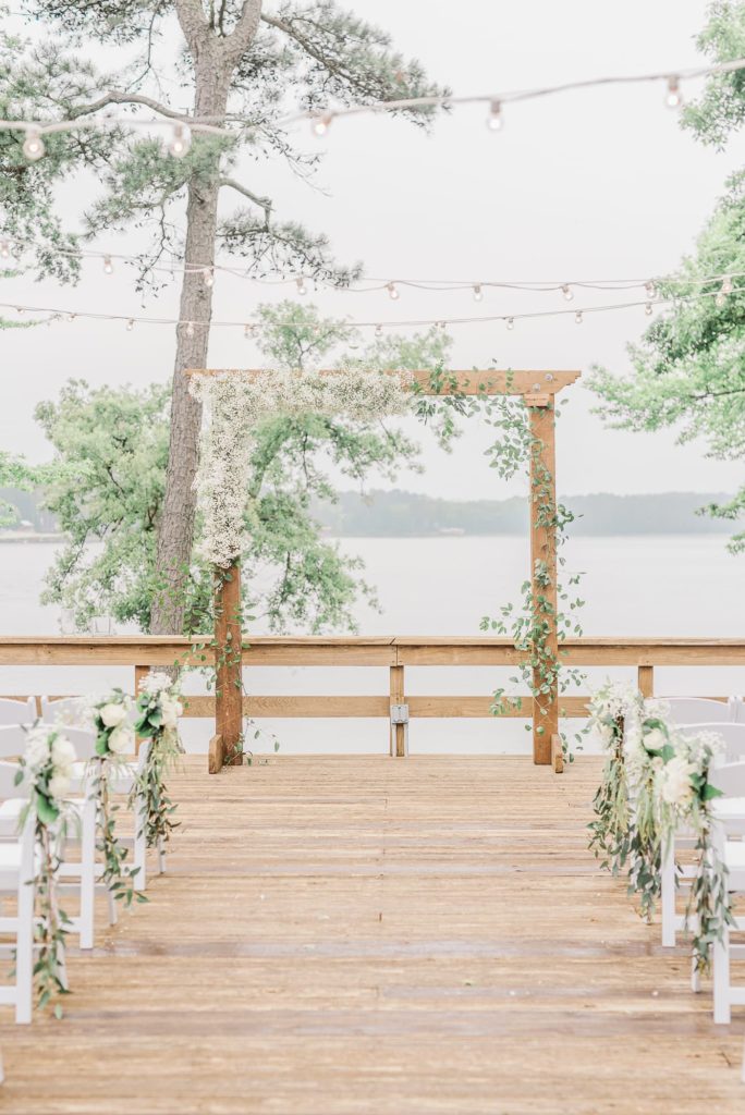 Ceremony arch florals at Lake Tyler Petroleum Club, Tyler TX.