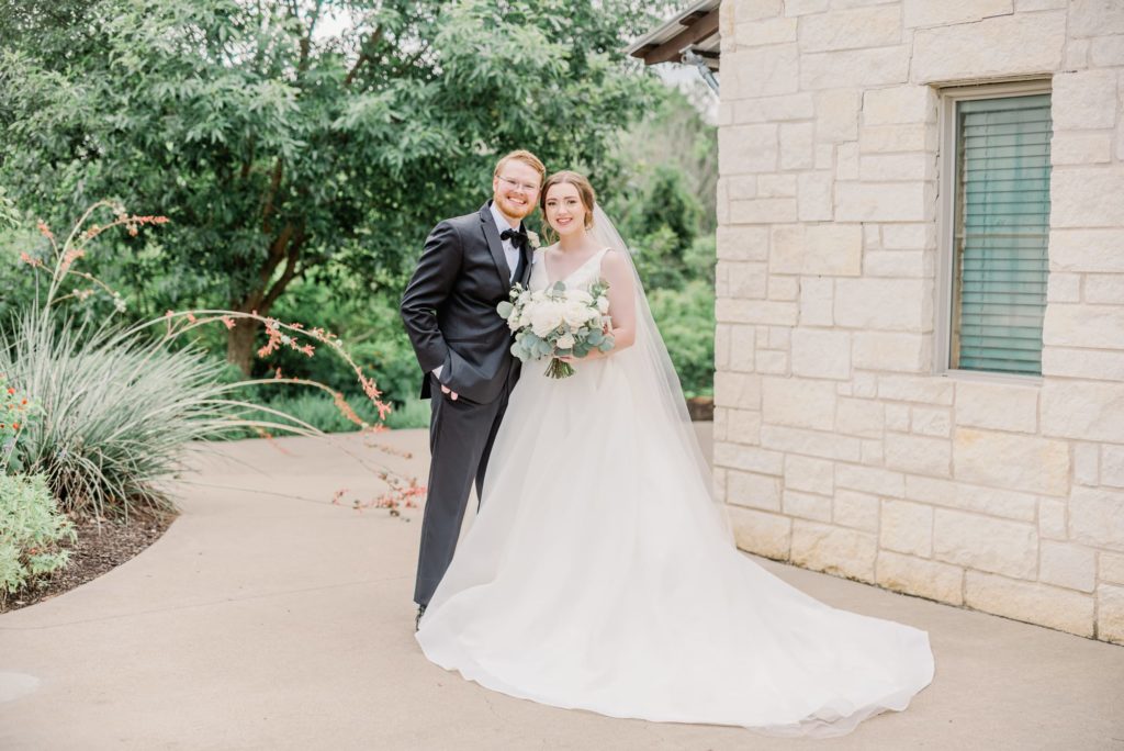 Bride and Groom Smiling for Portrait | Carleen Bright Arboretum in Waco TX by DFW Dallas wedding photographer Karina Danielle Photography