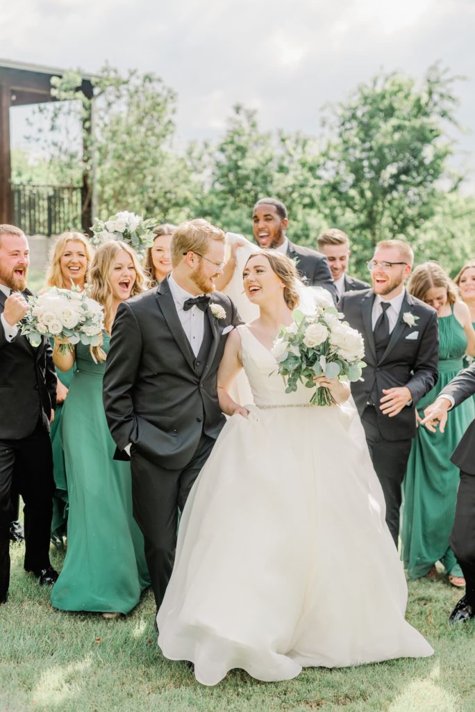 Bridal Party Cheering Bride and Groom | Carleen Bright Arboretum in Waco TX by DFW Dallas wedding photographer Karina Danielle Photography