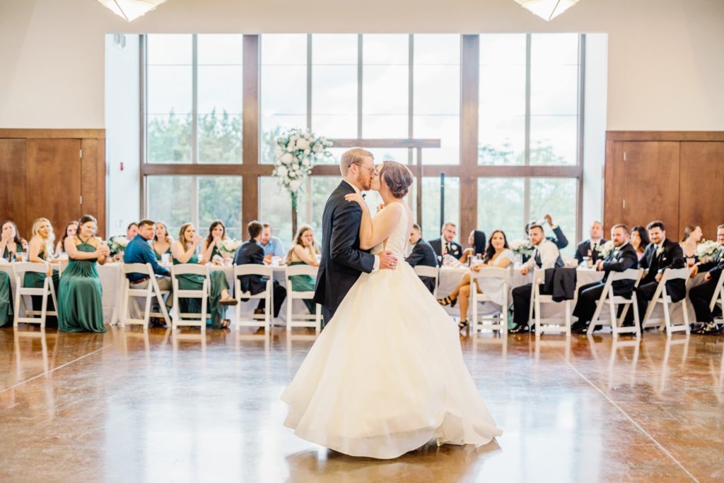 Bride and Groom Kiss During First Dance | Carleen Bright Arboretum in Waco TX by DFW Dallas wedding photographer Karina Danielle Photography