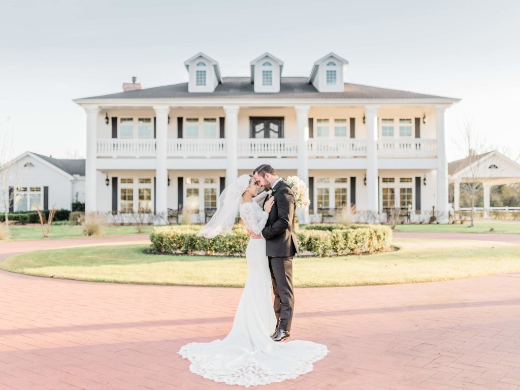 Bride and groom at southern style mansion Dallas Wedding Venue The Springs Rockwall.