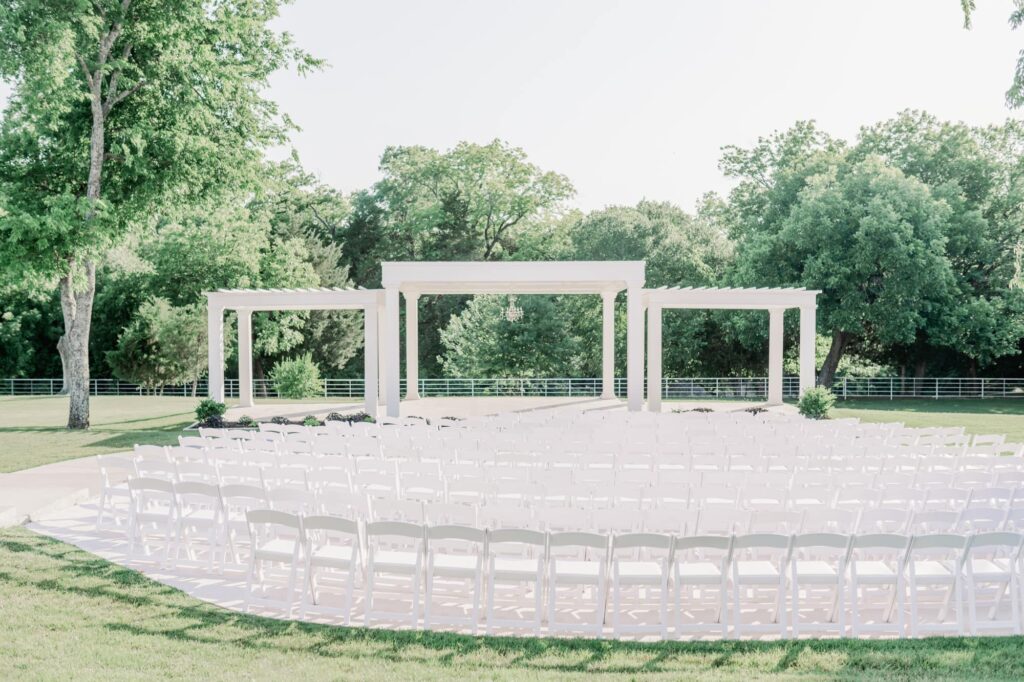Chairs curved around outdoor ceremony space at Firefly Gardens wedding venue.