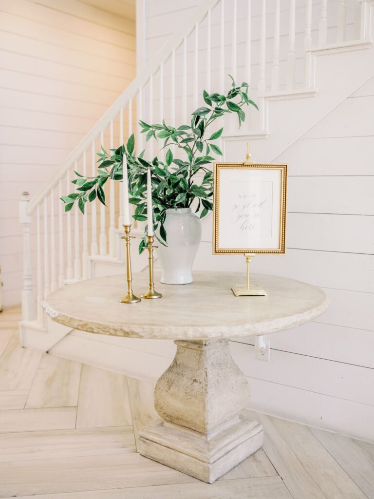 Entryway with table and greenery at the Nest at Ruth Farms.