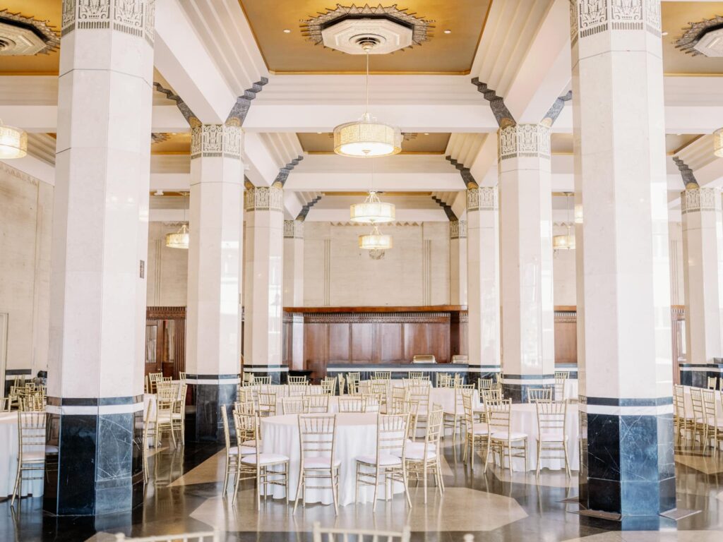 Wedding reception with white linens and gold chairs at the Carlisle in Dallas.