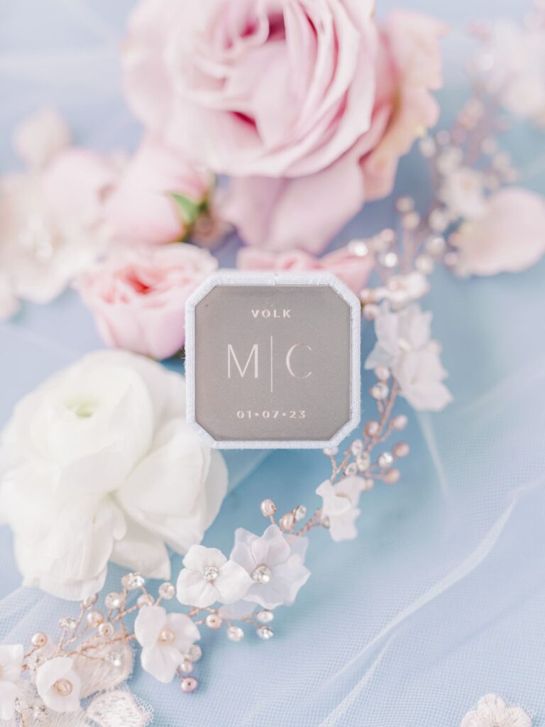 Sky blue Mrs. Ring box with floral hair vine.